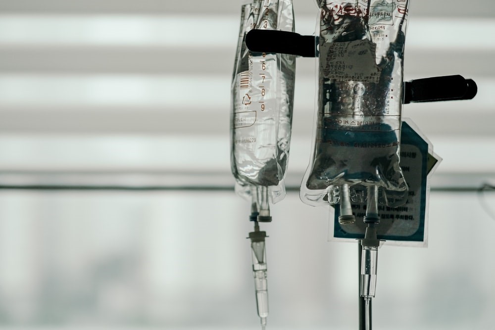 IMAGE 2 Photograph of a drip stand in a hospital setting. Heparin tends to be delivered intravenously in liquid form. 
