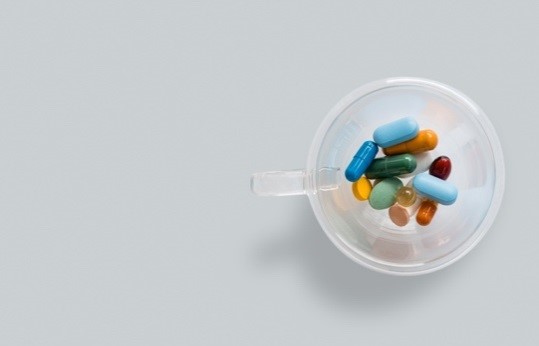 IMAGE 2 Image of multiple differently coloured tablets in a glass mug. This represents the form in which beta blockers would be administered (however this would be a single tablet taken at the frequency recommended by your doctor. 