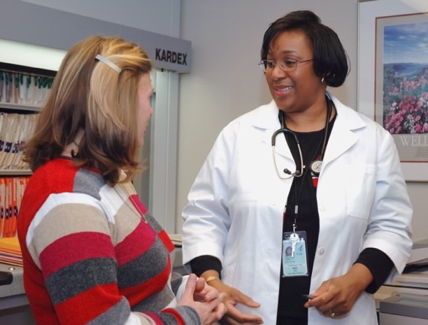 IMAGE 3:Image of a female health care professional in discussion with a female patient. Used to represent the conversation Sally will be having with her doctor to decide her next treatment steps. 